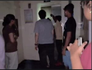 Two female students stuck in a lift.